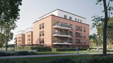 Modernes, vierstöckiges Wohngebäude aus Klinker mit Balkonen und Grünanlage.